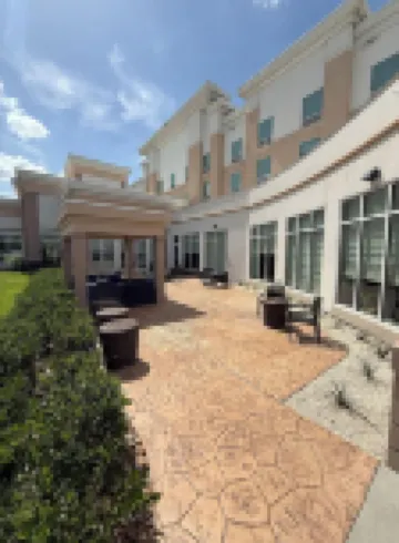 Kozy Hotel Houston North Отели в г. 