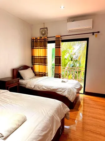 Vang Vieng Global Hostel Отели рядом с достопримечательностью «Wat That»