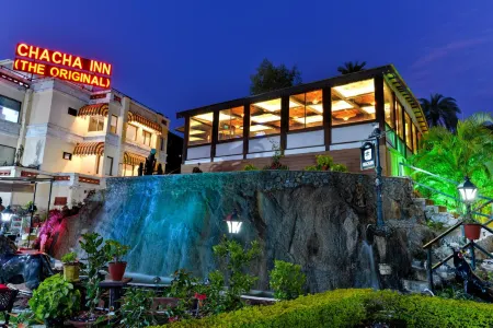 Chacha Inn the Garden Retreat Отели рядом с достопримечательностью «Пандав Бгаван Комплекс»