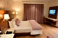 Mastiff Grand Dharwad Hotels near Kamat Tourist