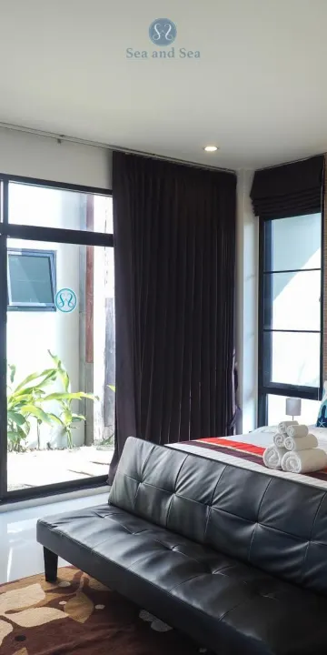 ห้องเตียงแฝดพร้อมลานระเบียงและวิวสวน