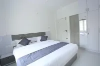 Yelza Hotel and Residence Hotels near Santhigiri Ashram