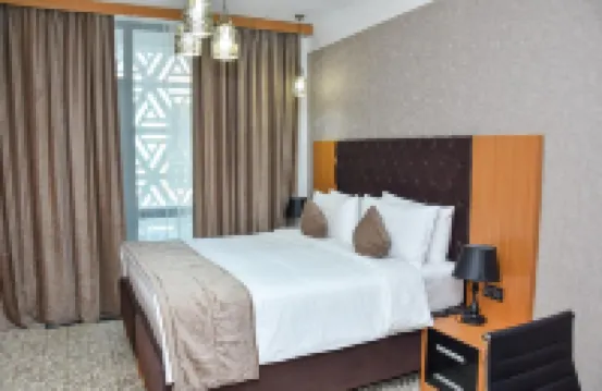 突厥斯坦温德姆華美達酒店 酒店