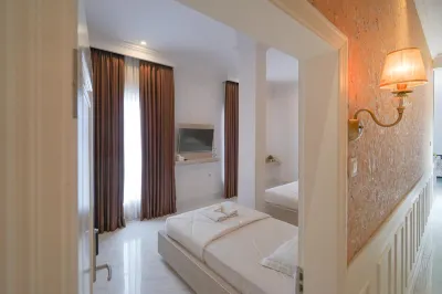 Wisma DKing RedPartner Hotel dekat Mytha kosmetik