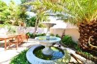 Secret Garden Guesthouse - Bãi đậu xe