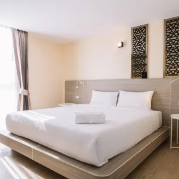 One Budget Hotel Chiangrai Phahonyothin Отели рядом с достопримечательностью «Парк развлечений Singha Park»