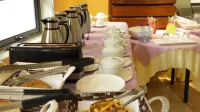 Tropical Plaza Apartments - petit déjeuner