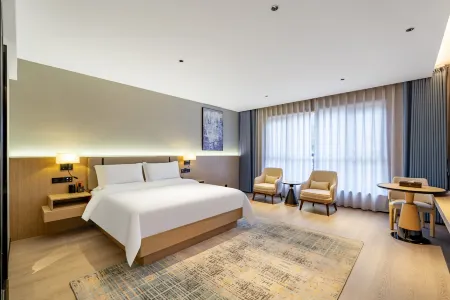 Yiliang Fei'er Lisi Hotel Отели рядом с достопримечательностью «Глобальный автомобильный пассажирский станция Ляо Ляо»