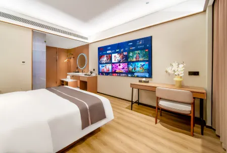 Baizhu Hotel (Zhangjiagang Jinfeng Branch) Отели рядом с достопримечательностью «Zhangjiagang Campus， the City Vocational College of Jiangsu (Binjiang Avenue)»