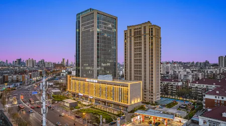 Rezen Dong Hotel (Tianjin Aoti Zhongxin Wangdingdi Subway Station) Отели рядом с достопримечательностью «Zhang Yuan»