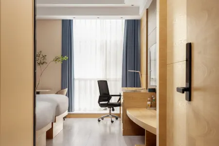 Huipuyi Comfortable Business Hotel (Linhai Yintai Branch) Отели рядом с достопримечательностью «Wangjiang Gate»