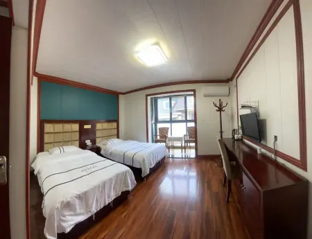 Wenchuan Erma Business Inn Отели рядом с достопримечательностью «Baihua Bridge Relic Site»