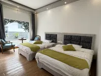 Jinghong Manzhelan Inn - Holiday Apartments
