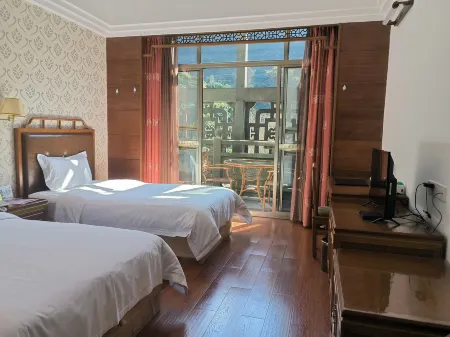 Jixiang Tiankeshe Hotel Отели рядом с достопримечательностью «Yearning Tea Plantation Tourist Attraction»