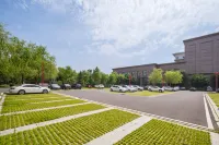 Meihekou Huju Hotel - parking
