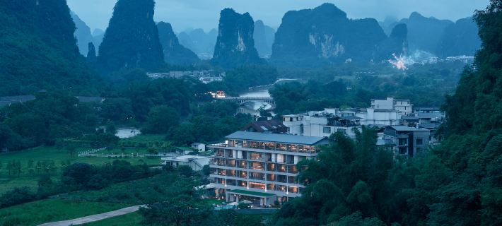 SYYF Holiday Hotel(Yangshuo Shiyuyuanfang) Отели в г. Яншуо