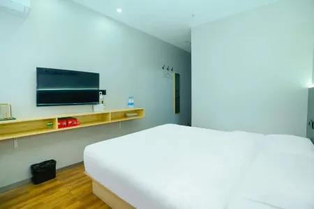 Zhengxuan Hotel (Jiaxing Nanhu Wanda Plaza) Отели в г. Цзясин