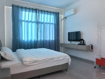 Longxing Business Inn Отели в г. Симэн