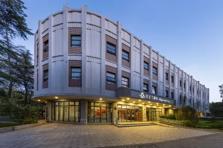 Magnotel Отели рядом с достопримечательностью «Shanghai University of Engineering Science (Xincun Road)»