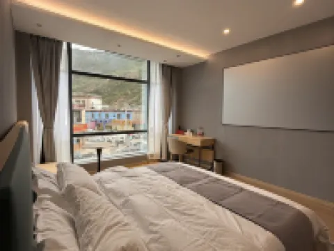 Huayi Business Hotel Hotel di Baqen