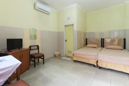 Penginapan Syariah Отели в г. Siak Hulu