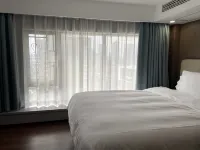 Xiaocheng International Apartment Hotel - balcony