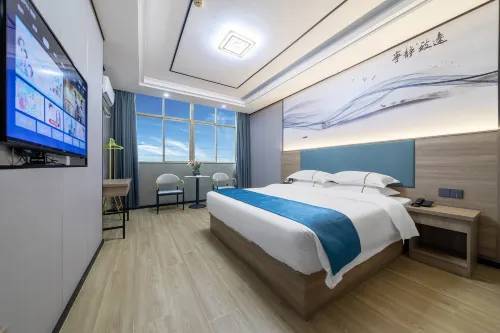 Wanning Jinhong Business Hotel (Huayacheng High-speed Railway Station)