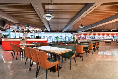 Haikou Mingguang Shengyi Hotel Отели рядом с достопримечательностью «Hainan Medical University (Chengxi Campus)»