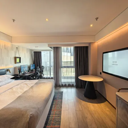 Yuyue Esports Hotel (Wuxi Meihua Li Wuyue Water Street Branch) Отели в г. Уси
