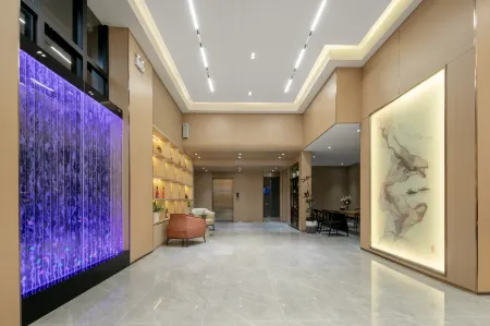 Kaman Hotel (Wuhan Roman Spring Outlets) Отели рядом с достопримечательностью «Wuhan Vocational College of Communication and Publishing»