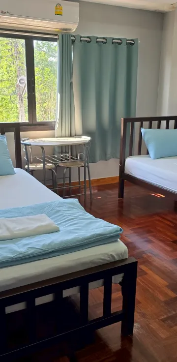 ห้องพักสำหรับสามท่านพร้อมวิวสวน