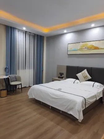 Shidian Magnolia Business Hotel Отели рядом с достопримечательностью «Yaoguan Ancient Town»