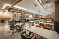 Xinlv Yige Hotel (Kuitun Dimao Hot Island Paradise Branch) - فطور