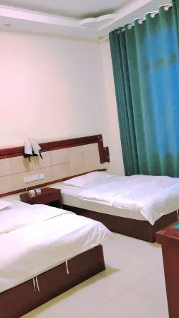 Yuanmou Jiatai Business Hotel Отели рядом с достопримечательностью «Langbapu Earth Forest (Xinhua Earth Forest)»