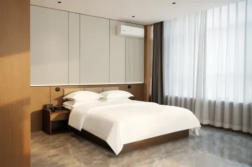 Daqing Youmi Hotel ( Bayi Agricultural University Moma Plaza)