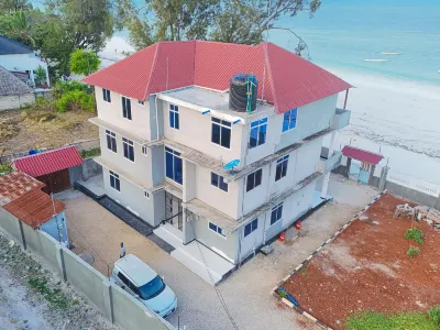 Uroa Beachfront 2BR • Balcony • Free Wi-Fi Hotels in 