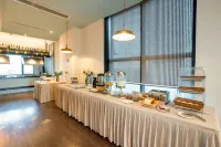 Milan Junyi Hotel - sarapan