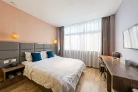 Holiday Boutique Hotel (Zhangjiagang Chang'an Middle Road) Hotels near shi ji guang chang