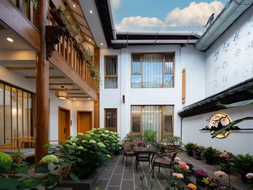 Windlnn.Boutique Garden Inn at Lijiang Old Town (South Gate) - ที่มีบาร์