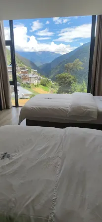 Shan Yu Guesthouse Отели рядом с достопримечательностью «Xiaonong Base camp»