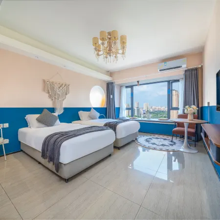 May Boutique Hotel (Xinyang East Railway Station Evergrande Plaza)