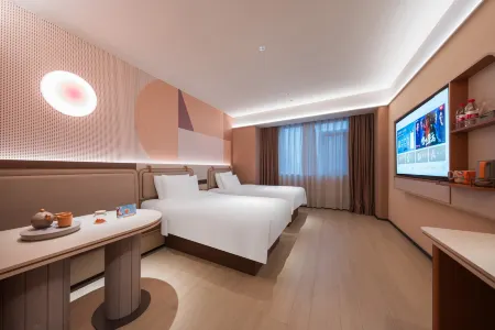 Orange Hotel (Weihai Weigao Plaza Xingfumen Branch) Отели рядом с достопримечательностью «Weihai Happiness Gate»