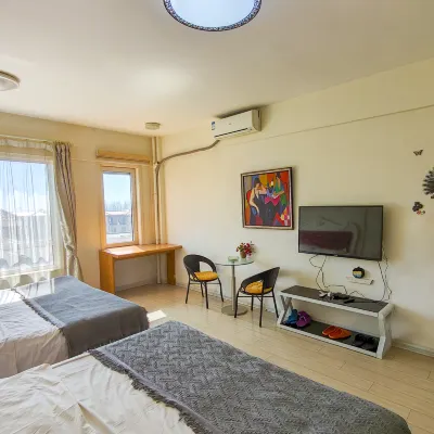 Sunshine Coast Apartment Hotel (Dalian Jiahua Sanbu) โรงแรมใกล้ต้าเหลียนดิสคัฟเวอรีคิงดอม
