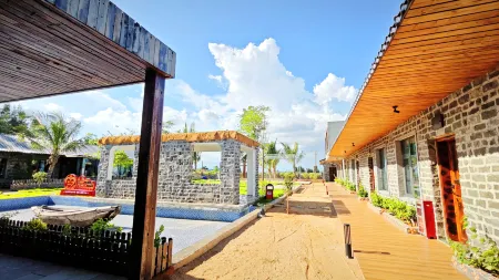 Xu Wen sha hai wan min su Отели рядом с достопримечательностью «Denglou Cape»