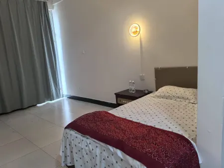 Jingyuan Apartment Отели рядом с достопримечательностью «Mengwozongfu Temple»