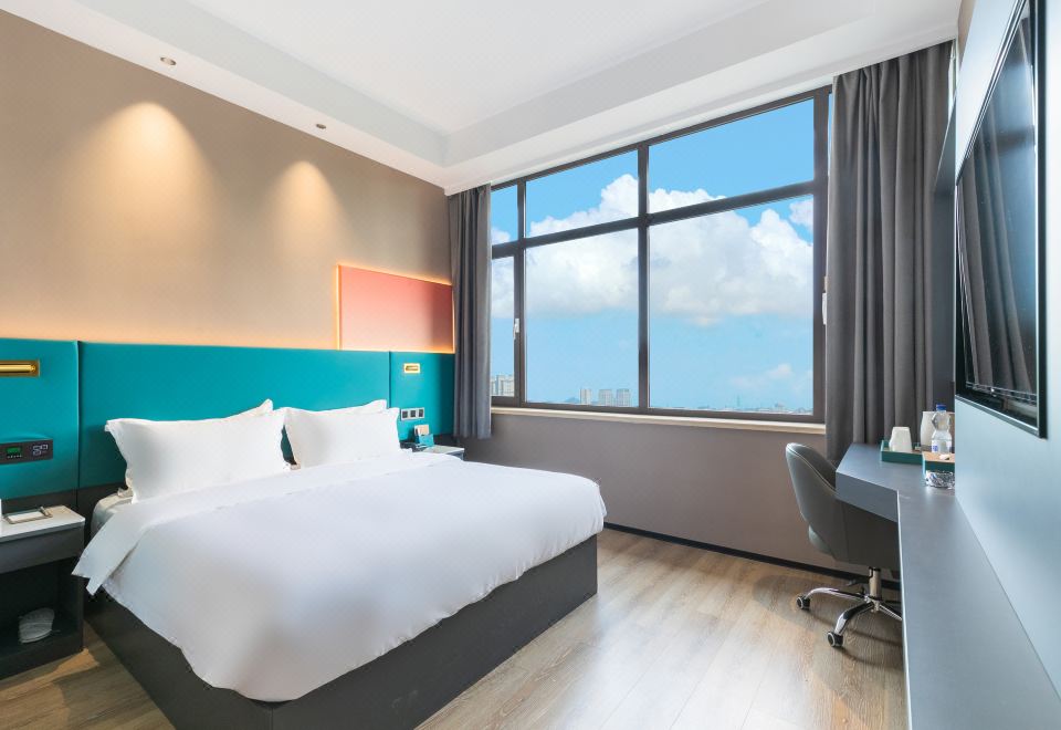 [Chaoman Hotel 객실의 제로 압력 매트리스가 강조된 침대 사진. 숙면을 유도하는 편안함이 느껴진다.]