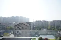 Floral Hotel·Summer Mountain Puju Homestay Отели рядом с достопримечательностью «Цюньмин Сен-Парк Шай-Ху»