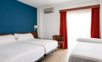 a hotel room with two beds , white bedding , and a blue wall , along with a window and an air conditioner at Catalonia Punta del Rey