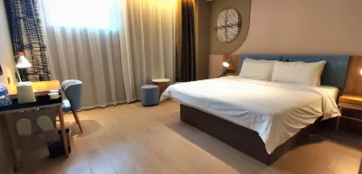 Yijia Hotel (Xinyi Railway Station Nanjing Road) Hotels near Landscape Belt of Shahe Wetland Park
