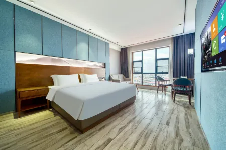 Mango Hotel Liyang (Municipal Government Branch) Отели рядом с достопримечательностью «Taozhu Memorial Hall»